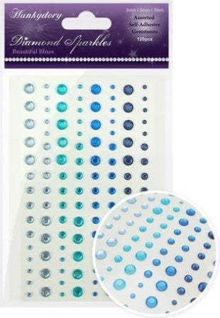 This stunning selection of brand new gemstones from Hunkydory Crafts is the perfect essential addition to your craft stash! The brand new packs include 3 different sizes – 3mm, 5mm and 7mm and include a range of colours. Available at Embellish Away located in Bowmanville Ontario Canada. Beautiful Blues