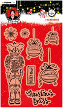 Load image into Gallery viewer, Studio Light - ABM Clear Stamp - Christmas Nutcracker - Essentials - 148x210x1mm - 1 PC - nr.81. This clear stamp set features a Nutcracker, ornaments, snowflakes and also the perfect Christmas and Winter sentiments. 8 stamps. Size: 5.8x8.3 in. Available at Embellish Away located in Bowmanville Ontario Canada.
