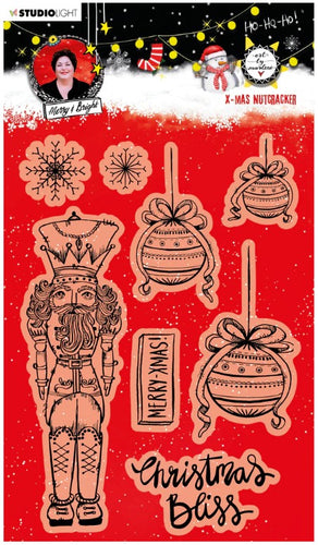 Studio Light - ABM Clear Stamp - Christmas Nutcracker - Essentials - 148x210x1mm - 1 PC - nr.81. This clear stamp set features a Nutcracker, ornaments, snowflakes and also the perfect Christmas and Winter sentiments. 8 stamps. Size: 5.8x8.3 in. Available at Embellish Away located in Bowmanville Ontario Canada.