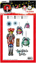 Load image into Gallery viewer, Studio Light - ABM Clear Stamp - Christmas Nutcracker - Essentials - 148x210x1mm - 1 PC - nr.81. This clear stamp set features a Nutcracker, ornaments, snowflakes and also the perfect Christmas and Winter sentiments. 8 stamps. Size: 5.8x8.3 in. Available at Embellish Away located in Bowmanville Ontario Canada.
