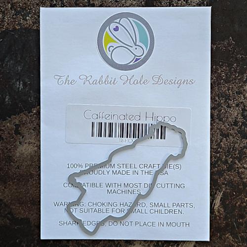 The Rabbit Hole Designs - Die - Caffeinated - Hippo. The Rabbit Hole Designs dies are made of durable 100% steel. Usable in nearly every machine on the market! Use on cardstock, felt, fabric or shrink plastic. You can use wafer thin dies to cut, stencil, emboss and create! made in USA. Available at Embellish Away located in Bowmanville Ontario Canada.