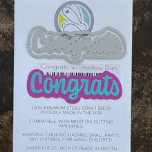 Load image into Gallery viewer, The Rabbit Hole Designs - Die Set - Congrats - Scripty Word with Shadow Layer. The Rabbit Hole Designs dies are made of durable 100% steel. Usable in nearly every machine on the market! Use on cardstock, felt, fabric or shrink plastic. You can use wafer thin dies to cut, stencil, emboss and create! Made in the USA.  Coordinates with Congrats - Scripty 3x4 Stamp Set. Available at Embellish Away located in Bowmanville Ontario Canada.
