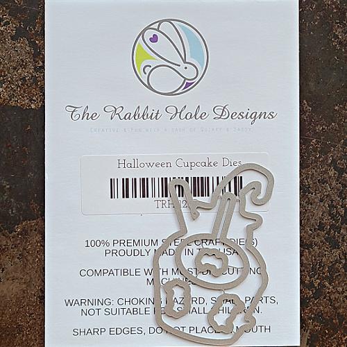 The Rabbit Hole Designs - Die Set - Chameleon. The Rabbit Hole Designs dies are made of durable 100% steel Usable in nearly every machine on the market! Use on cardstock, felt, fabric or shrink plastic. You can use wafer thin dies to cut, stencil, emboss and create! Made in the USA.  Coordinates with the Halloween Cupcake 3x4 Stamp Set. Available at Embellish Away located in Bowmanville Ontario.