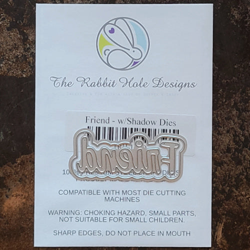 The Rabbit Hole Designs - Dies - Friend. This package includes 2 dies, 1 shadow and 1 script. Coordinates with Friend - Scripty 3x4 Stamp Set and  Friend - Scripty Word Hot Foil Plate. Available at Embellish Away located in Bowmanville Ontario Canada.