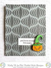 Load image into Gallery viewer, The Rabbit Hole Designs - Stamp Set - 3x4 - Halloween Cupcake. Deeply etched, clear photopolymer stamps for precise placement. Made in the USA.  Coordinates with Halloween Cupcake Die. Available at Embellish Away located in Bowmanville Ontario Canada. Card design by Kelly B.
