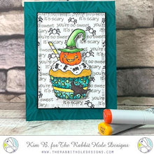Load image into Gallery viewer, The Rabbit Hole Designs - Stamp Set - 3x4 - Halloween Cupcake. Deeply etched, clear photopolymer stamps for precise placement. Made in the USA.  Coordinates with Halloween Cupcake Die. Available at Embellish Away located in Bowmanville Ontario Canada. Card design by Kim B.
