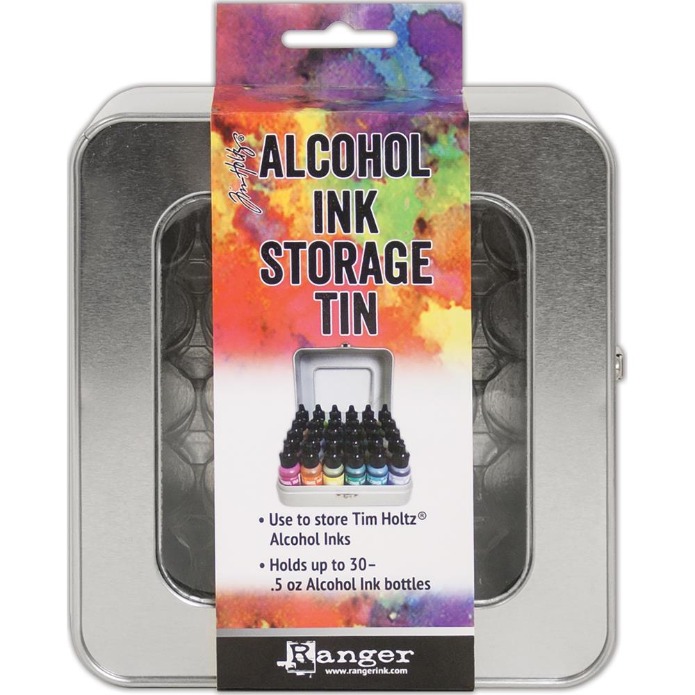 Tim Holtz - Alcohol Ink Storage Tin. The Tim Holtz Alcohol Ink Storage Tin is the ideal storage solution for Alcohol Ink bottles. It features a clear window and hinged metal closure. Available at Embellish Away located in Bowmanville Ontario Canada.