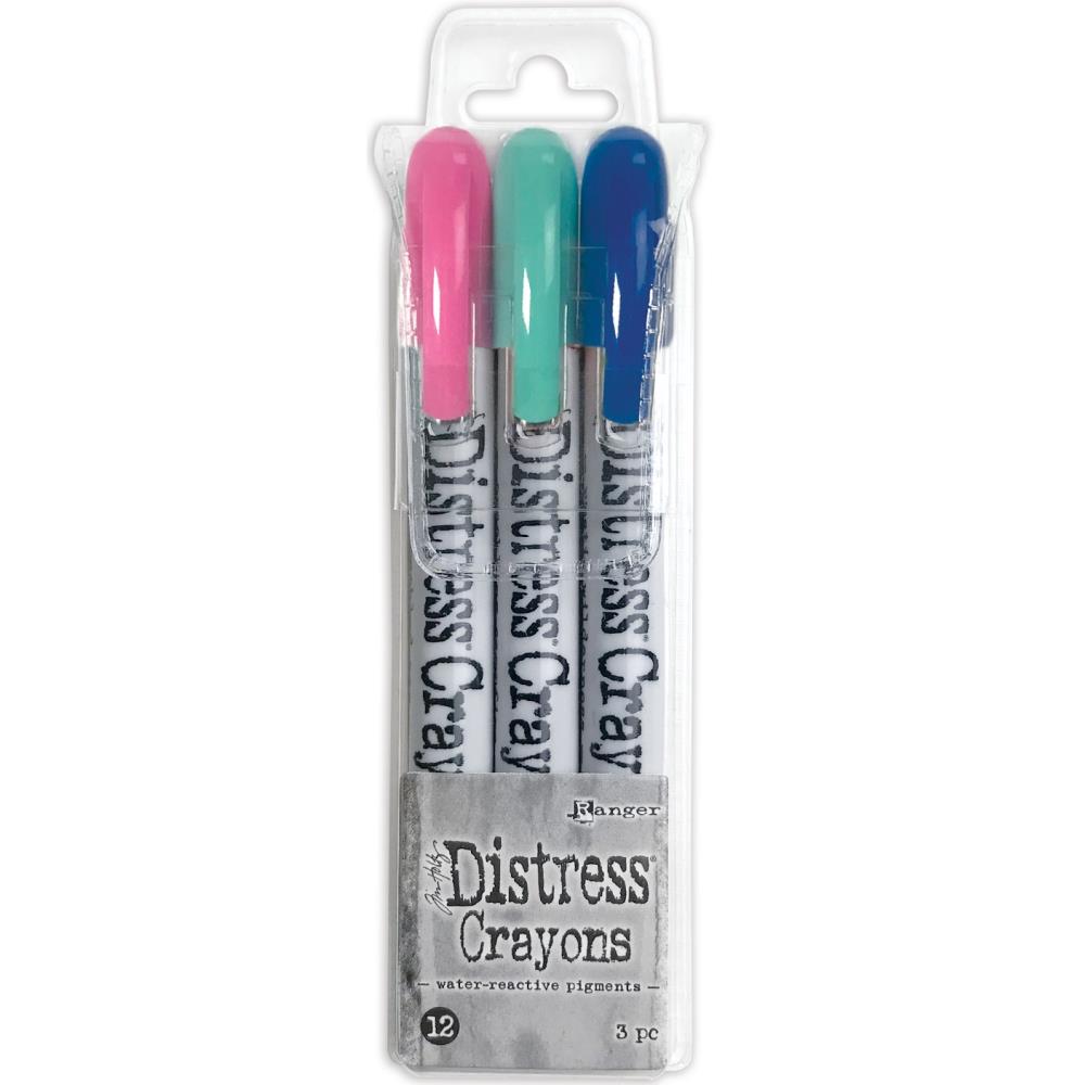 Ranger - Tim Holtz - Distress Crayon Set - Set #12. Tim Holtz Distress Crayons are formulated to achieve vibrant coloring effects on porous surfaces for mixed-media. The smooth water-reactive pigments are ideal for creating brilliant backgrounds, watercoloring and more. This package contains three 5.25 inch long crayons in Kitsch Flamingo, Prized Ribbon and Salvaged Patina Distress. Available at Embellish Away located in  Bowmanville Ontario Canada.