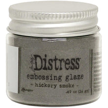 Load image into Gallery viewer, Tim Holtz - Distress Embossing Glaze - Hickory Smoke. Add dimension to your projects with new embossing glaze! These translucent embossing powders are ideal for layering on surfaces. This package contains .49oz of embossing glaze. Conforms to ASTM D 4236. Comes in a variety of colors. Each sold separately. Made in USA. Available at Embellish Away located in Bowmanville Ontario Canada.
