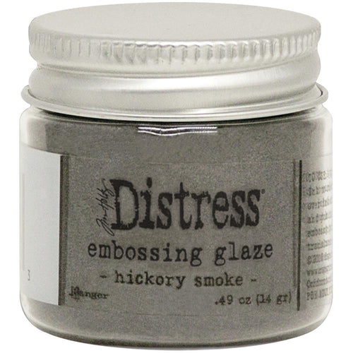 Tim Holtz - Distress Embossing Glaze - Hickory Smoke. Add dimension to your projects with new embossing glaze! These translucent embossing powders are ideal for layering on surfaces. This package contains .49oz of embossing glaze. Conforms to ASTM D 4236. Comes in a variety of colors. Each sold separately. Made in USA. Available at Embellish Away located in Bowmanville Ontario Canada.