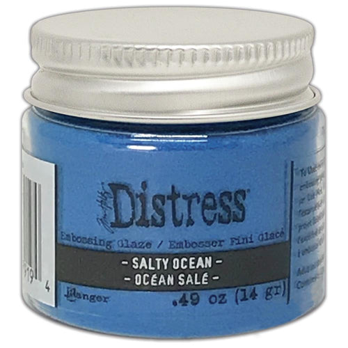 Tim Holtz - Distress Embossing Glaze - Salty Ocean. Add dimension to your projects with new embossing glaze! These translucent embossing powders are ideal for layering on surfaces. This package contains .49oz of embossing glaze. Conforms to ASTM D 4236. Comes in a variety of colors. Each sold separately. Made in USA. Available at Embellish Away located in Bowmanville Ontario Canada.