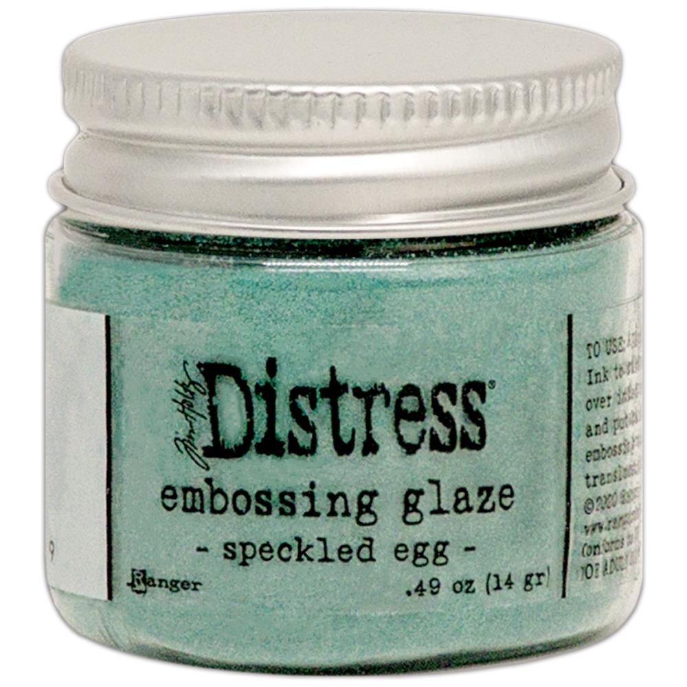 Tim Holtz - Distress Embossing Glaze - Speckled Egg. Add dimension to your projects with new embossing glaze! These translucent embossing powders are ideal for layering on surfaces. This package contains .49oz of embossing glaze. Conforms to ASTM D 4236. Comes in a variety of colors. Each sold separately. Made in USA. Available at Embellish Away located in  Bowmanville Ontario Canada.