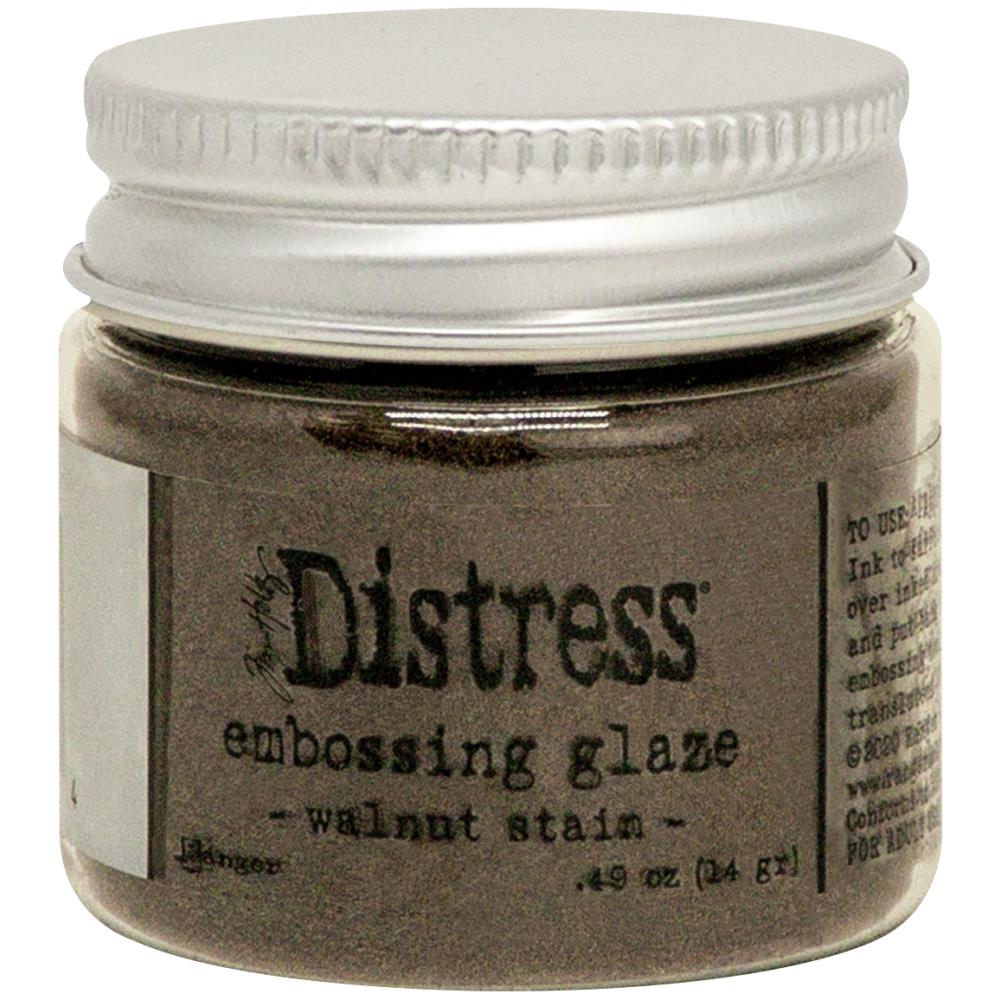 Tim Holtz - Distress Embossing Glaze - Walnut Stain. Add dimension to your projects with new embossing glaze! These translucent embossing powders are ideal for layering on surfaces. This package contains .49oz of embossing glaze. Conforms to ASTM D 4236. Comes in a variety of colors. Each sold separately. Made in USA. Available at Embellish Away located in Bowmanville Ontario Canada.