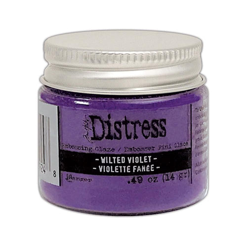 Tim Holtz - Distress Embossing Glaze - Wilted Violet. Add dimension to your projects with new embossing glaze! These translucent embossing powders are ideal for layering on surfaces. This package contains .49oz of embossing glaze. Conforms to ASTM D 4236. Comes in a variety of colors. Each sold separately. Made in USA. Available at Embellish Away located in Bowmanville Ontario Canada.
