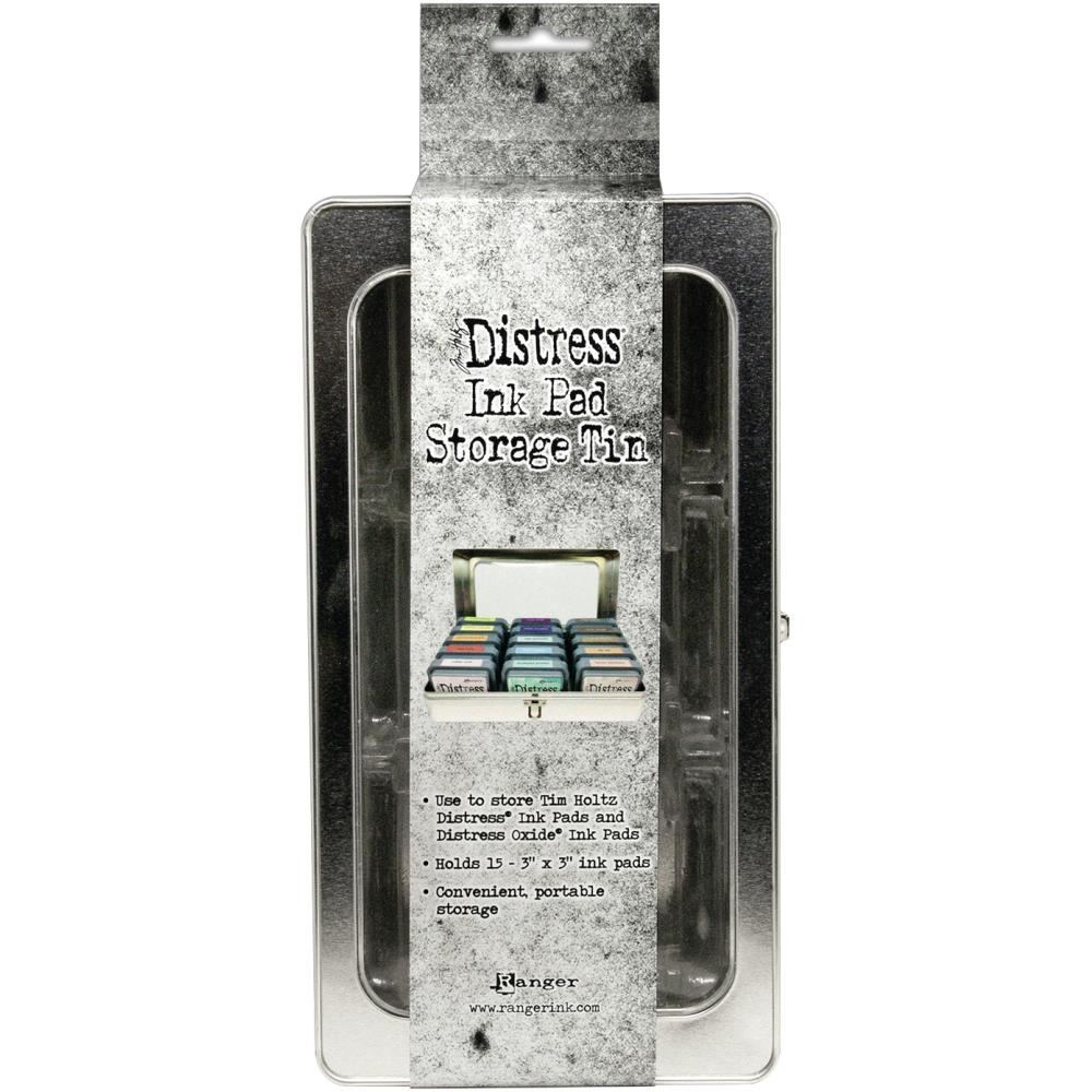 Tim Holtz - Distress Ink Pad Tin. The ideal storage for Tim Holtz Distress Ink Pads and Distress Oxide Ink Pads (sold separately). Organize and transport ink pads easily in this convenient tin. Features a clear window and hinged metal closure. Available at Embellish Away located in Bowmanville Ontario Canada.