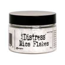Charger l&#39;image dans la galerie, Tim Holtz - Distress Mica Flakes - 50g. This assortment of various sized translucent mica flakes will add an old-fashioned subtle sparkle. Adhere flakes with Distress Collage Medium, Ranger Glossy Accents, or other adhesives (sold separately). This package contains 50g of mica flakes. Conforms to ASTM D 4236. Imported. Available at Embellish Away located in Bowmanville Ontario Canada.
