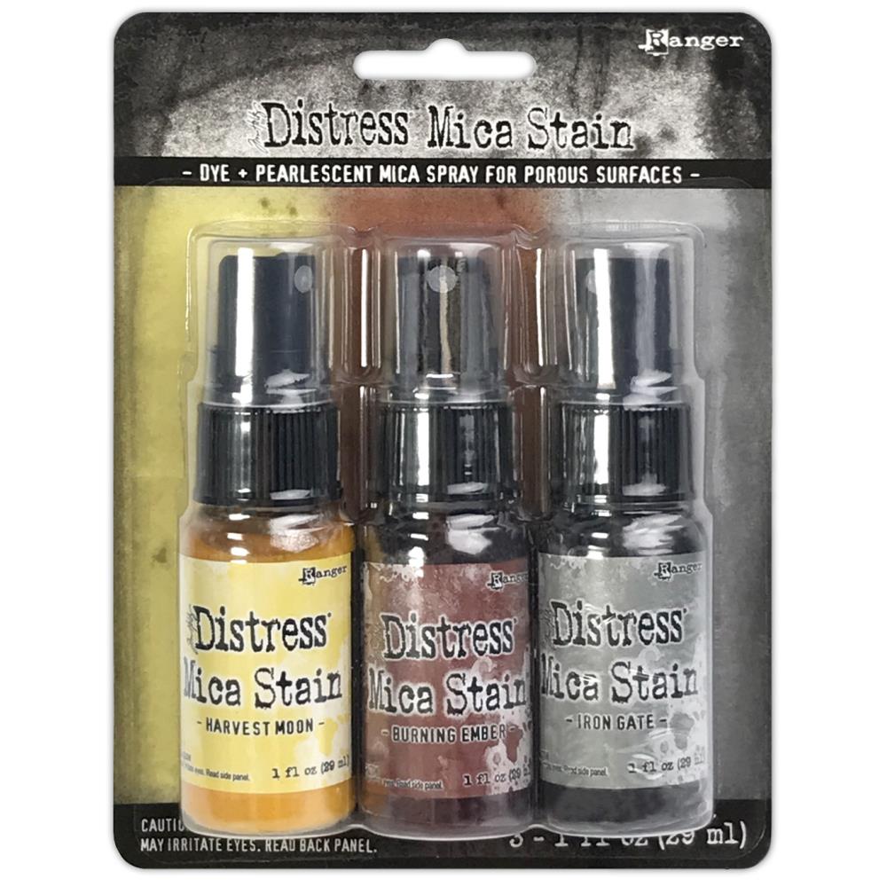 Tim Holtz - Distress Mica Stain Set - Halloween Set# 3. Tim Holtz Distress Halloween Mica Stains add colorful pearlescent shimmer to mixed media and paper craft projects. Mica Stains adhere to paper, canvas, wood, fabric and other porous surfaces. Available at Embellish Away located in Bowmanville Ontario Canada.