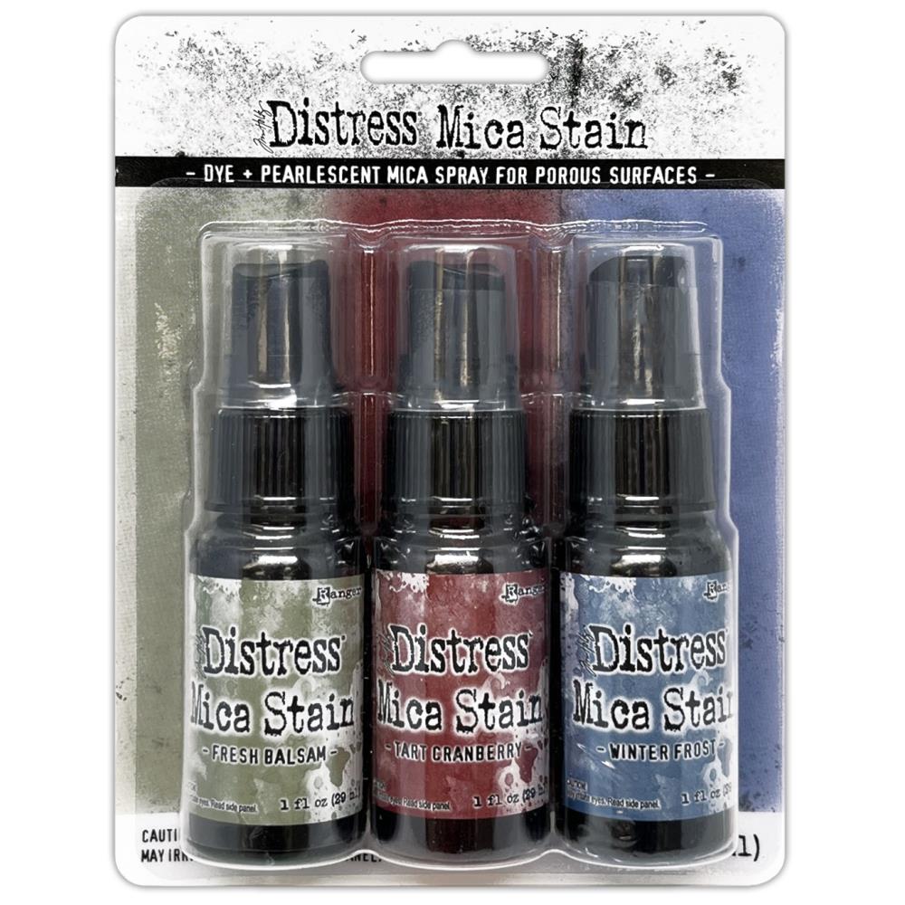 Tim Holtz - Distress Mica Stain Set - Holiday Set# 3. Tim Holtz Distress Holiday Mica Stains add colorful pearlescent shimmer to mixed media and paper craft projects. Mica Stains adhere to paper, canvas, wood, fabric and other porous surfaces. Available at Embellish Away located in Bowmanville Ontario Canada.