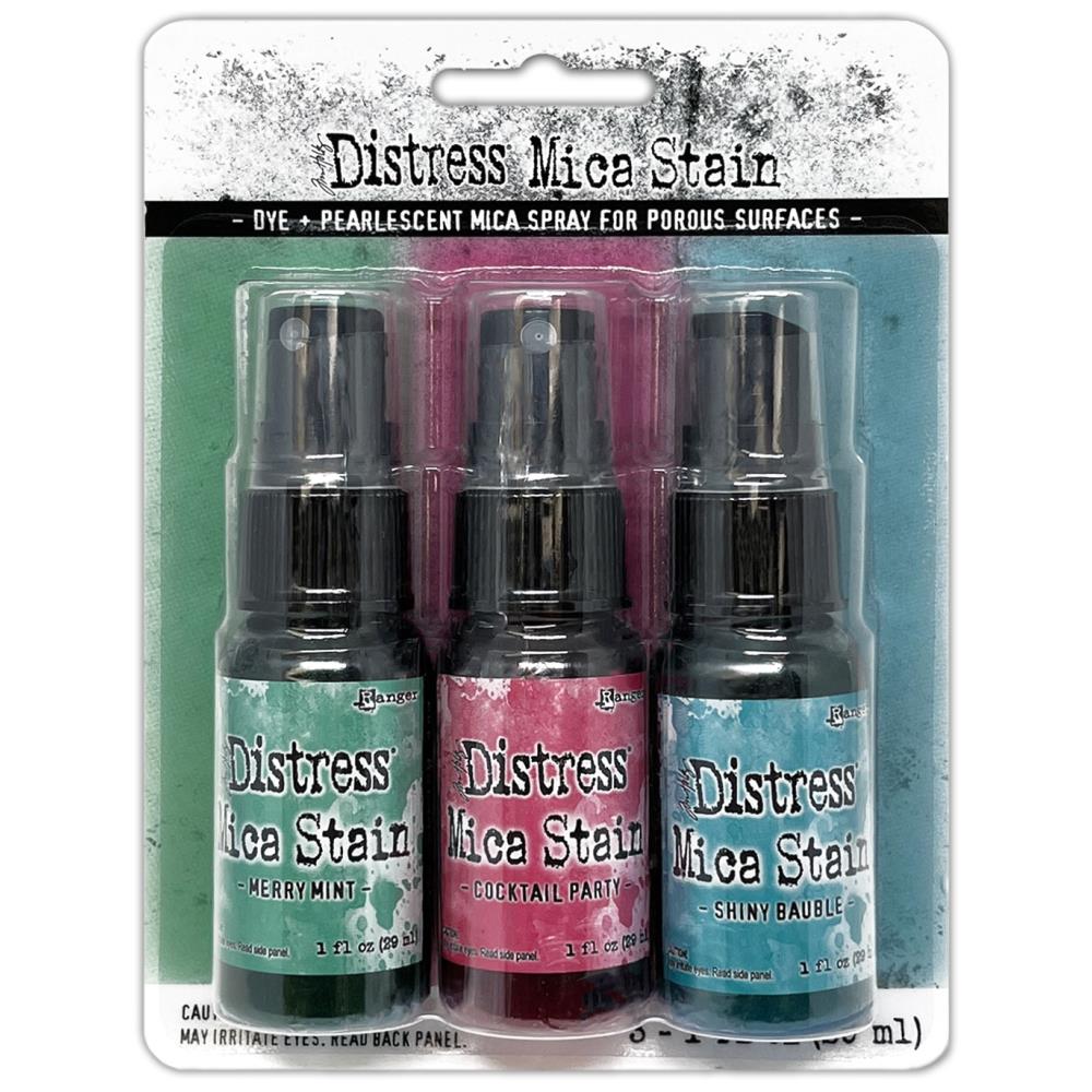 Tim Holtz - Distress Mica Stain Set - Holiday Set# 4. Tim Holtz Distress Holiday Mica Stains add colorful pearlescent shimmer to mixed media and paper craft projects. Mica Stains adhere to paper, canvas, wood, fabric and other porous surfaces. Available at Embellish Away located in Bowmanville Ontario Canada.