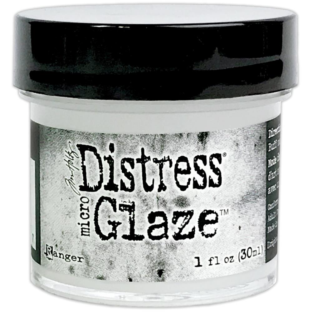 Ranger - Tim Holtz - Distress Micro Glaze - 1oz. Perfect for use on paper crafting projects, watercolors and ink jet printing. Now there is a way to seal your Distress projects. The new Tim Holtz Distress Micro Glaze is the perfect water resistant sealer for craft projects. Ideal for sealing Distress Ink, Markers, Stain, Paint & more. Easy to apply, Micro Glaze dries to a smudge resistant, waterproof finish.  Available at Embellish Away located in Bowmanville Ontario Canada.