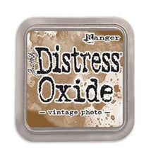 Load image into Gallery viewer, Tim Holtz - Distress Oxide Pad - Large. Create an aged look on papers, fibers, photos and more! This package contains one 2-1/4x2-1/4 inch ink pad. Comes in a variety of distressed colors. Each sold separately. Available at Embellish Away located in Bowmanville Ontario Canada. Vintage Photo.
