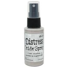 Load image into Gallery viewer, Tim Holtz - Distress Oxide Spray. Creates oxidized effects when sprayed with water. Use for quick and easy ink coverage on porous surfaces. Spray through stencils, layer colors, spritz with water and watch the color mix and blend.  Available at Embellish Away located in Bowmanville Ontario Canada. Lost Shadow

