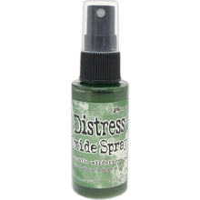 Load image into Gallery viewer, Tim Holtz - Distress Oxide Spray. Creates oxidized effects when sprayed with water. Use for quick and easy ink coverage on porous surfaces. Spray through stencils, layer colors, spritz with water and watch the color mix and blend.  Available at Embellish Away located in Bowmanville Ontario Canada. Rustic Wilderness

