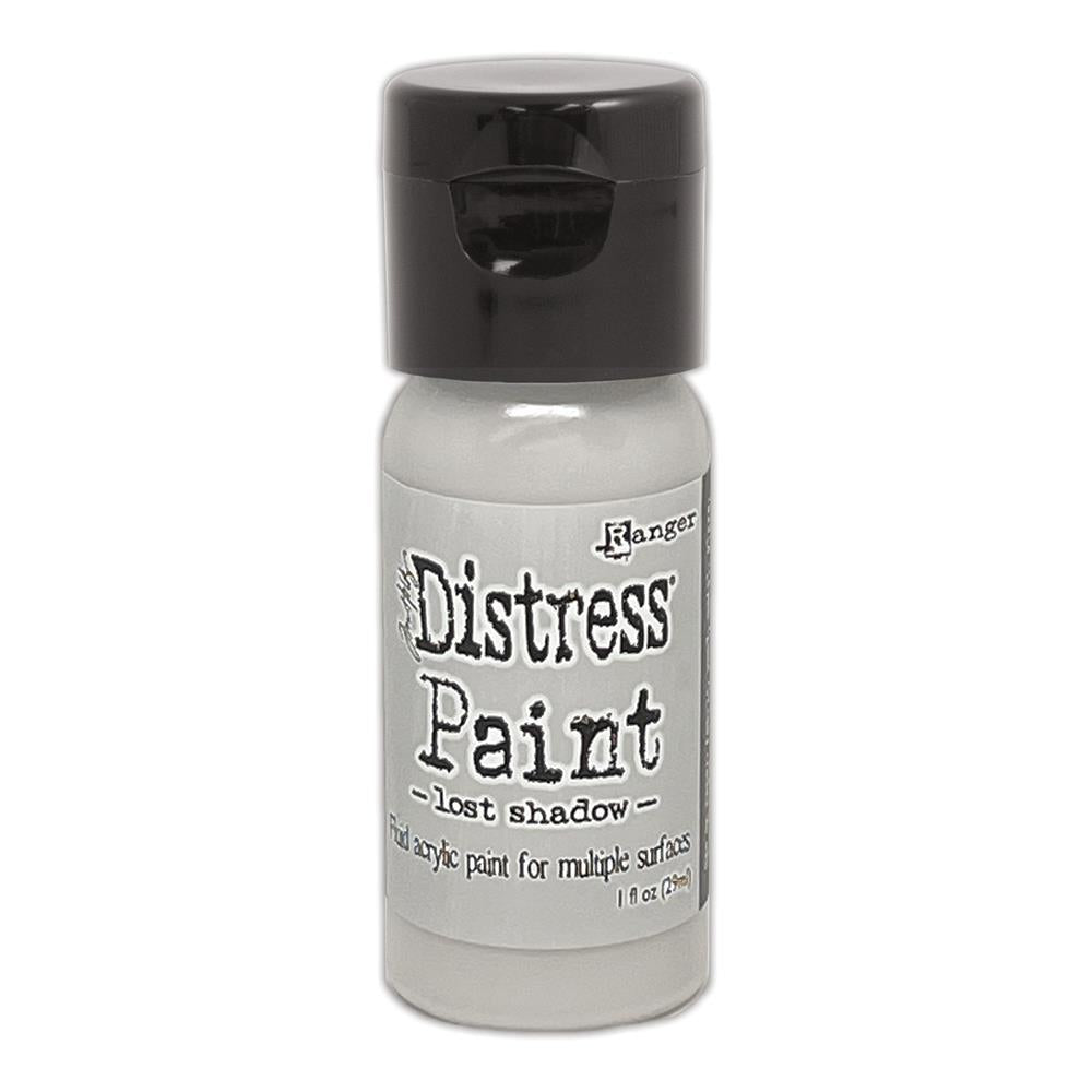 Tim Holtz - Distress Paint Flip Top 1oz - Lost Shadow. This package contains one 1oz bottle of acrylic paint. Comes in a variety of colors. Each sold separately. Made in USA. Available at Embellish Away located in Bowmanville Ontario Canada.