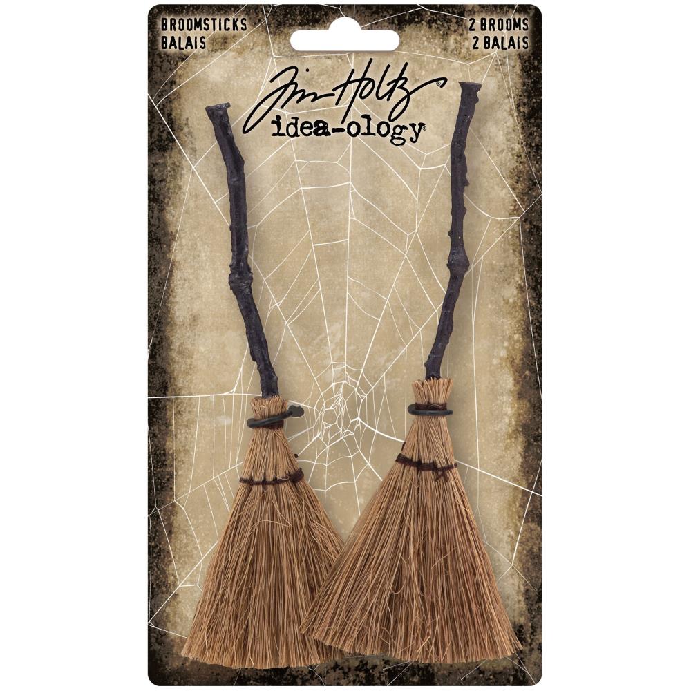 Tim Holtz - Idea-Ology - Broomsticks - 2/Pkg. With Tim Holtz Broomsticks, your spooky Halloween scene can take flight. These detailed broomsticks feature a crooked wooden broom handle and stitched brush. 2 pieces Elements measure: 1.5 x 5.0 inches. Available at Embellish Away located in Bowmanville Ontario Canada.