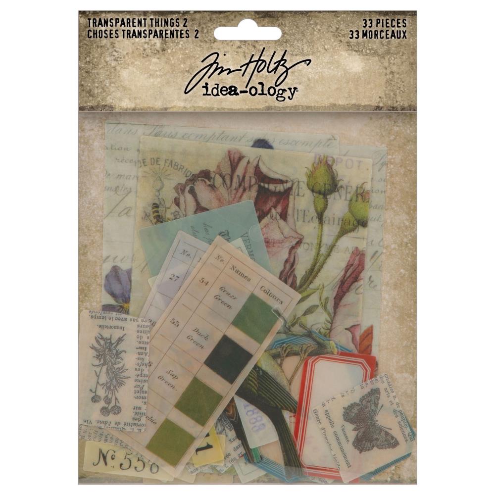 Tim Holtz - Idea-Ology - Transparent Things 2. Unleash your creativity with unique vintage transparent layers! Perfect for mixed media art projects, these layers offer a wide variety of designs, including birds, nature, and color swatches. Available at Embellish Away located in Bowmanville Ontario Canada.