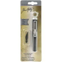 Cargar imagen en el visor de la galería, Tim Holtz - Retractable Craft Knife W/3 Blades. Perfect for crafting, rubber stamping and scrapbooking! This package contains one retractable craft knife and two spare blades. WARNING: Sharp edge. Imported. Available at Embellish Away located in Bowmanville Ontario Canada.

