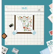 Load image into Gallery viewer, We R Memory Keepers - All-In-One Magnetic Platform. The All-In-One Magnetic Platform is perfect for stenciling, aligning, embossing, and cutting. One side is an easy-clean work surface. Available at Embellish Away located in Bowmanville Ontario Canada.

